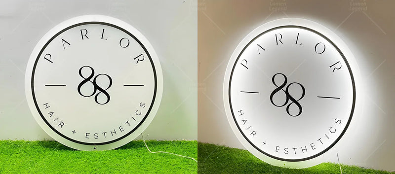 Elegant acrylic backlit sign designed for a hair and esthetics salon, featuring minimalist black typography and a soft white glow that enhances the modern, high-end atmosphere of the beauty space.