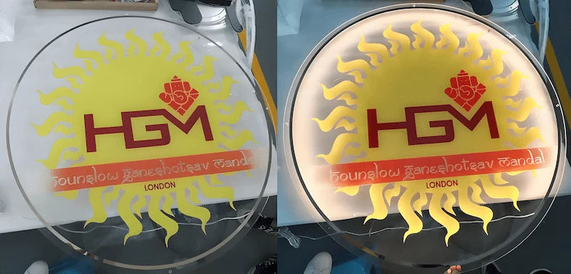 Custom acrylic LED backlit sign with “HGM” and sunburst logo design for cultural or temple decoration.