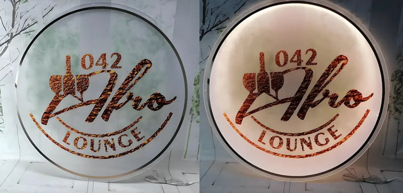 Custom round acrylic backlit sign for Afro Lounge with textured copper logo design, showing vibrant LED backlighting and natural daylight appearance.