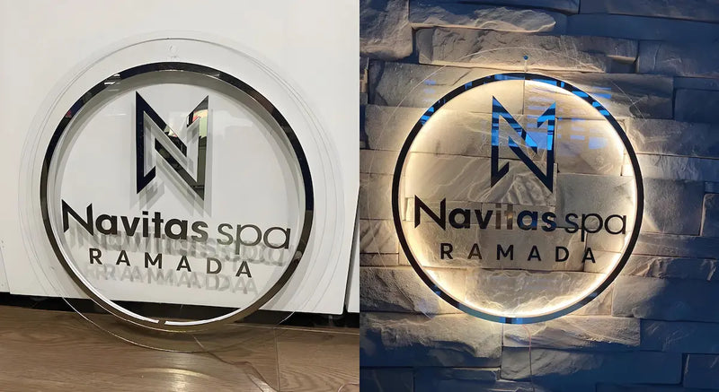 Round custom acrylic backlit sign with chrome edge and soft LED light for Navitas Spa Ramada, modern spa logo signage illuminated and non-illuminated view.