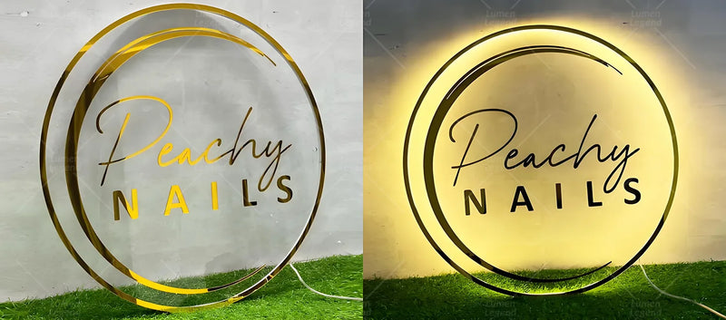 Elegant round acrylic backlit sign with gold mirror finish displaying “Peachy Nails”. The glowing halo light creates a soft luxury look, perfect for modern nail studios, spas, and beauty salons.