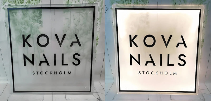 Square custom acrylic backlit sign with “KOVA NAILS STOCKHOLM” logo, designed for modern nail salon branding.